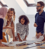 A diverse market research team discussing a project, representing inclusive research practices