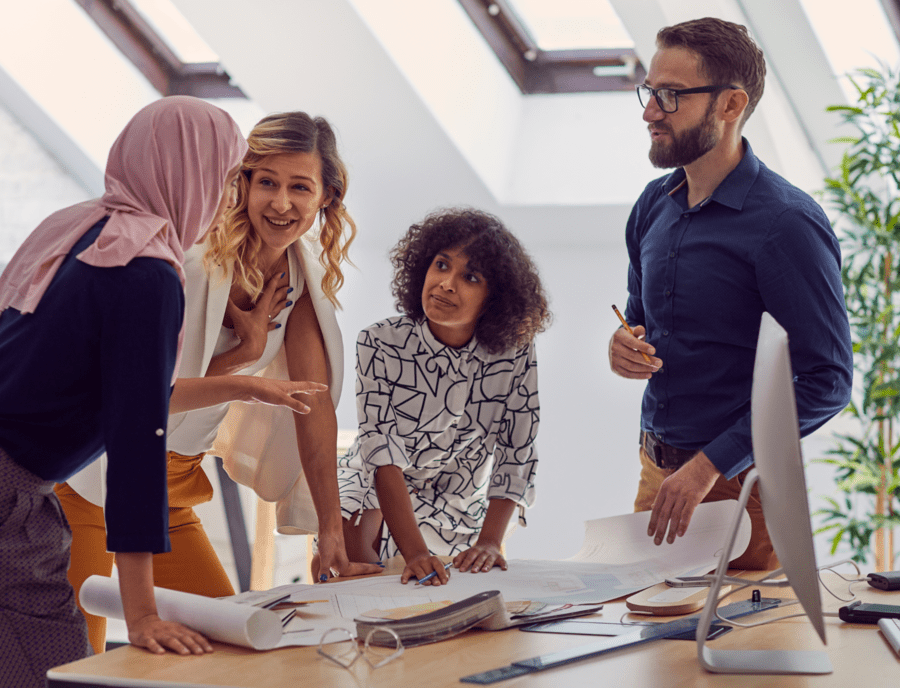 A diverse market research team discussing a project, representing inclusive research practices