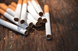 Tobacco-cigarettes-on-wooden-background-672146424_1258x838 Tobacco-cigarettes-on-wooden-background-672146424_1258x838